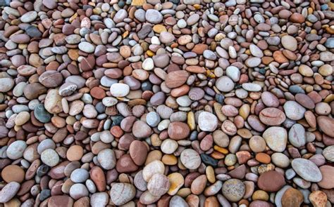 Multi Coloured Pebbles On A Beach In The Uk Stock Image Image Of