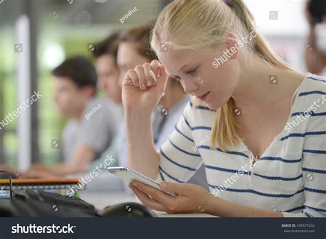High School Girl Using Smartphone In Class Stock Photo 145577434