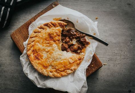 Steak and kidney pie, a traditional british dish consisting of diced steak, onion, and kidney—typically from a lamb or pig—cooked in a brown gravy and then wrapped in a pastry and baked. Steak and Kidney Pie Recipe | Greendale Farm Shop