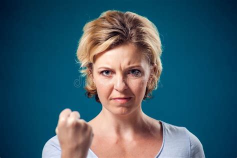 A Portrait Of Angry Woman Showing Fist At Camera People And Emotions