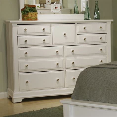 The triple dresser, finished in eggshell white, sits on a decorative shaped block base supported by bun feet. Vaughan Bassett Cottage BB24-002 Triple Dresser | Dunk ...