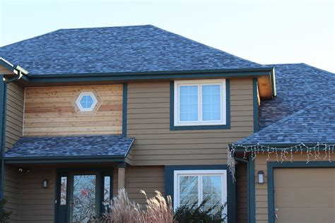 The first is the brown shingles and the copper metal roof at the very top of the house. Home Exterior Makeover- Pewaukee - BCI Exteriors