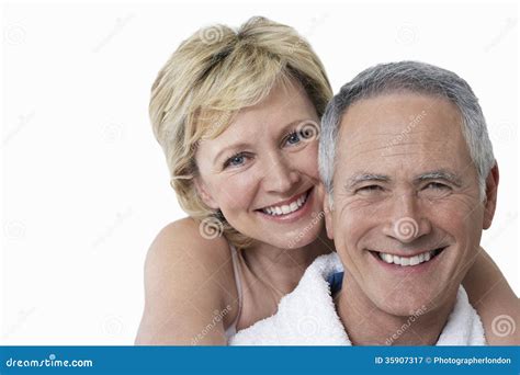 Portrait Of Loving Couple Smiling Over White Background Stock Image