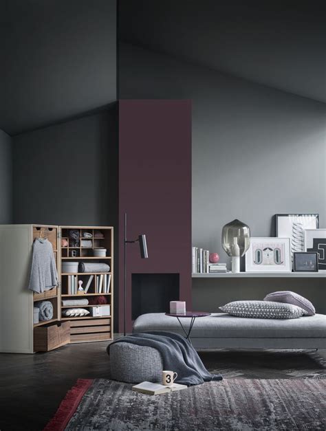 A Living Room Filled With Furniture And A Book Shelf Next To Its Fireplace