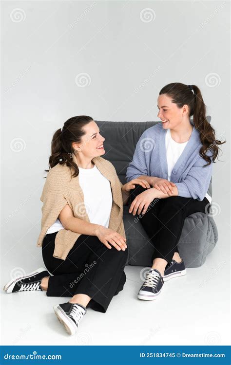 Two Beautiful Women Twin Sisters Posing White Background Having Fun