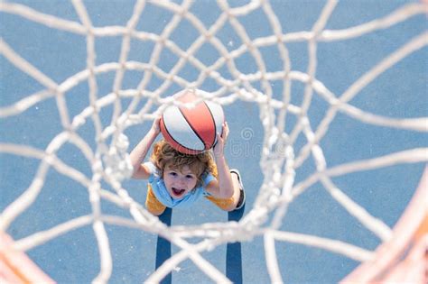 Basketball Game Kid Training With Basket Ball On Basketball Court