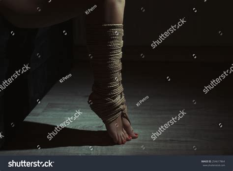 Beautiful Legs Tied With Rope In Bondage Photo Toning 254617864