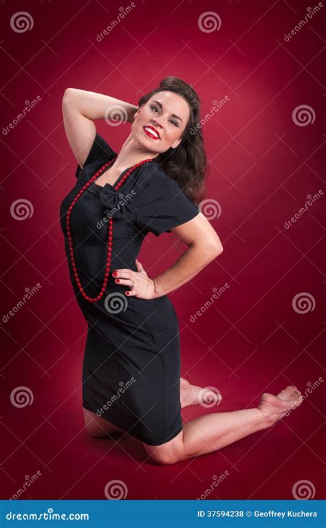 Pinup Girl In Black Dress Kneels Stock Photo Image Of Female Kneel
