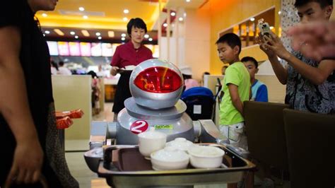 robots to cook and serve food in restaurant in kunshan china
