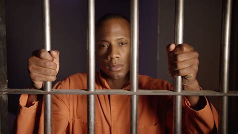 african american man behind bars - Stock Footage Video (100% Royalty ...