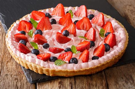 Sweet Berry Tart With Whipped Cream Strawberries And Blueberries Close