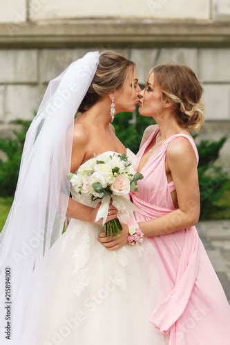 Bride And Bridesmaid Kissing At Wedding Day Happy Marriage And Wedding