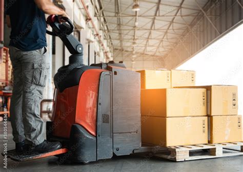 Shipment Boxes Cargo Warehousing Worker Driving Electric Forklift Pallet Jack Unloading