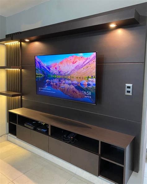A Flat Screen Tv Mounted To The Side Of A Wall