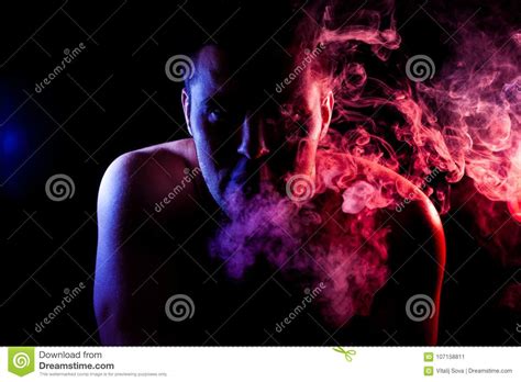 Man Exhales A Cloud Of Colored Smoke Stock Image Image Of City Adult