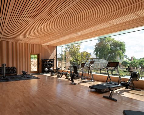 Invisible Studio Designs Hotel Gym Overlooking Productive Garden