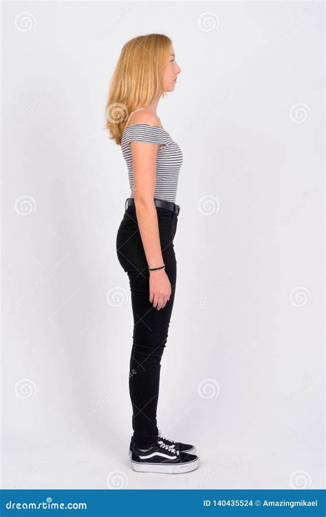 Full Body Shot Profile View Of Young Beautiful Blonde Teenage Girl