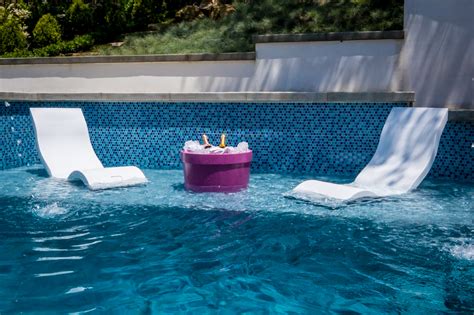The top of the chair is given a net look covering which comes with a small cushion attached with resting arms on the side. Ledge Lounger: The Ultimate "In-Water" Pool Furniture ...