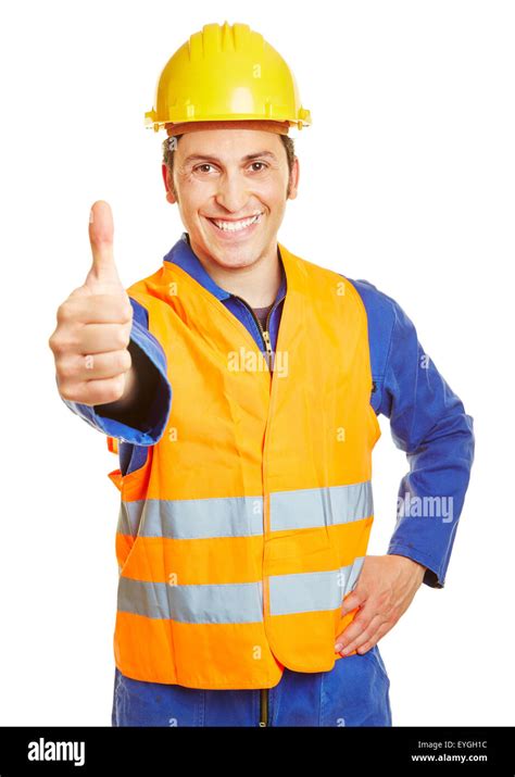 Smiling Construction Worker With Hardhat Holding Thumbs Up Stock Photo