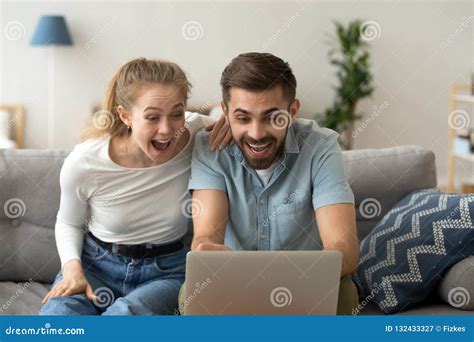 excited couple shocked by unexpected online win stock image image of online apartment 132433327