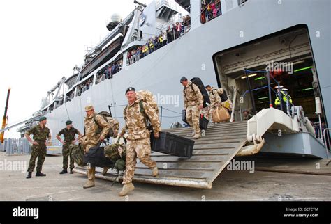troops join previously stranded british holiday makers returning home to the uk aboard the royal