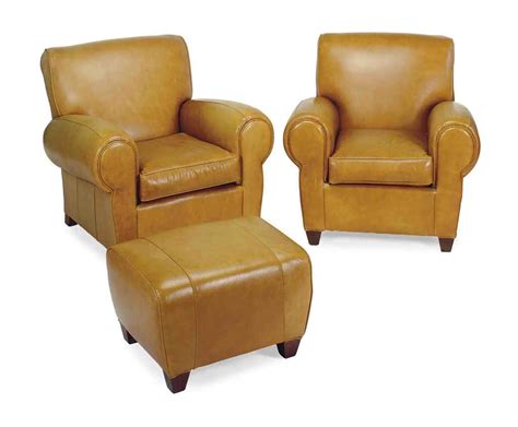 Yep, sometimes ya gotta put your feet up, and let's face it, it still has to look good. A PAIR OF TAN LEATHER-UPHOLSTERED CLUB CHAIRS AND OTTOMAN ...