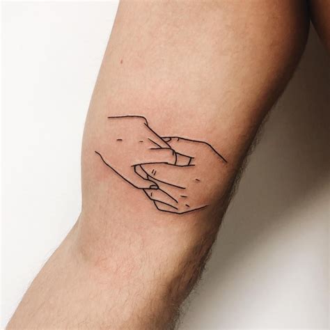 Outline Two Holding Hands Tattoo On The Right Bicep Two Hands Tattoo