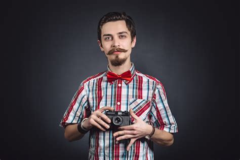 Free Photo Portrait Of A Cheerful Photographer In Studio