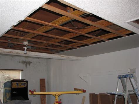 An ambitious homeowner can remove popcorn ceilings with nothing rather than remove asbestos ceiling popcorn it is legal to contain it by plastering over it with encapsulating asbestos is perfectly acceptable and safer to do. Melbourne Beach water damaged drywall and popcorn ceiling
