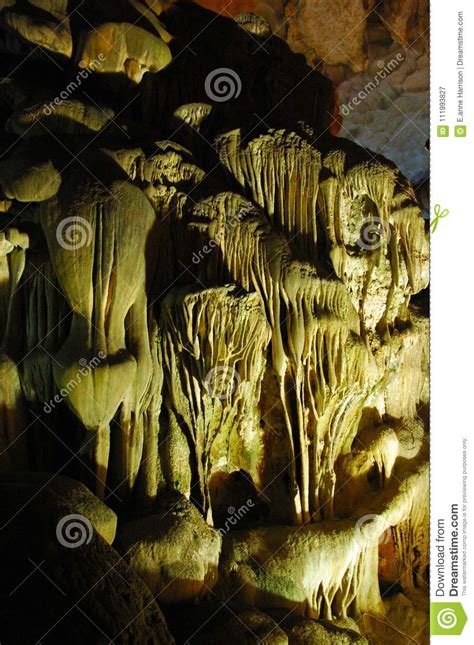 Spotlit Stalactites In A Cave Forming Grotesque Shapes Stock Image