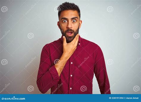 Young Indian Man Wearing Red Elegant Shirt Standing Over Isolated Grey