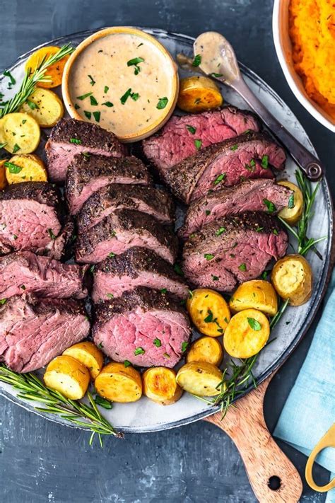 Potato side dishes always pair well with beef, like potato gratin, crispy smashed potatoes, or a lighter cauliflower mashed potatoes side. the best beef tenderloin recipe on a plate with brandy ...