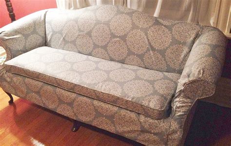 Contemporary Skirt Style Slipcover On A Camelback Sofa With Contoured