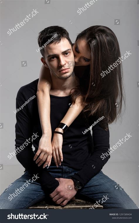 Beautiful Brunette Girl Hugging Behind Guy Stock Photo 1291589434