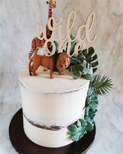 Semi Naked Buttercream Cake For A 1st Birthday Wild One Caketopper Fondant Jungle Leaves And