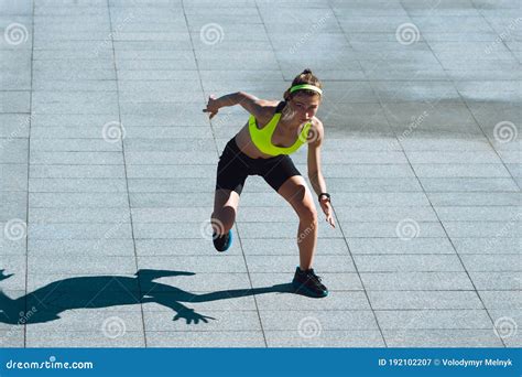 Female Runner Athlete Training Outdoors In Summer`s Sunny Day Stock