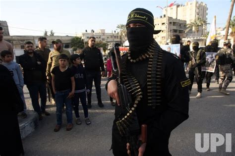 Photo Palestinian Fighters Take Part In A Parade In Gaza Support Of