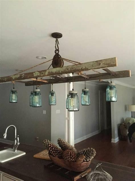 Find everything you need to make your home a rustic retreat. Mason jar and ladder lighting over a kitchen island.... | Rustic kitchen lighting, Farmhouse ...