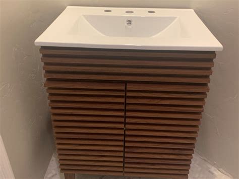 I am installing a new vanity / top combo in a bathroom i am in the process of remodeling. HELP! Issue with vanity not being flush against wall