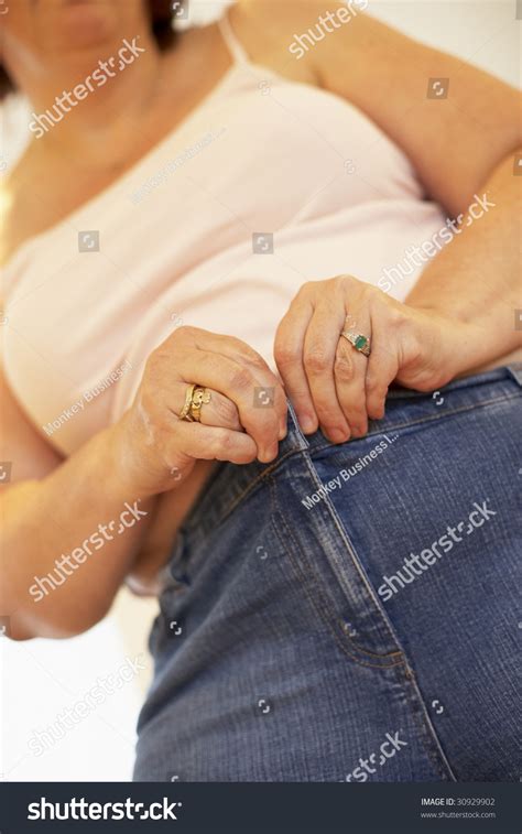 Overweight Woman Trying Fasten Trousers Stock Photo 30929902 Shutterstock