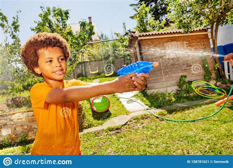 Portrait Of A Boy Shoot Water Gun In Fight Game Stock Image Image Of
