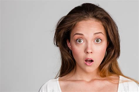 Portrait Of Surprised Brunette With Big Eyes Stock Photo Download