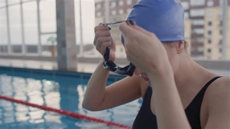 Handheld Slowmo Close Up Of Professional Female Swimmer In Swimsuit And