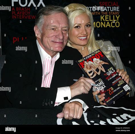 Hugh Hefner And His Three Girlfriends Autograph The November Issue Of