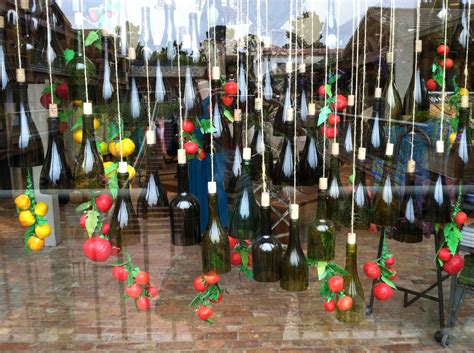 Hanging Wine Bottles And Fruit Anthropologie Window Display