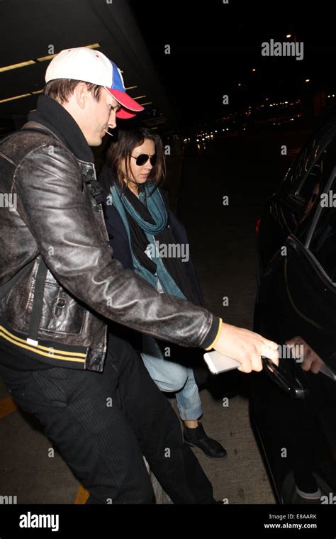 Ashton Kutcher And Pregnant Fiancee Mila Kunis Get Into A Waiting Car At Los Angeles