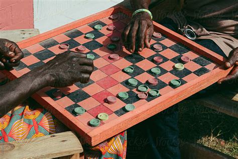 Men Playing Draughts Board Game By Ogoh Clement Checkers Board Game
