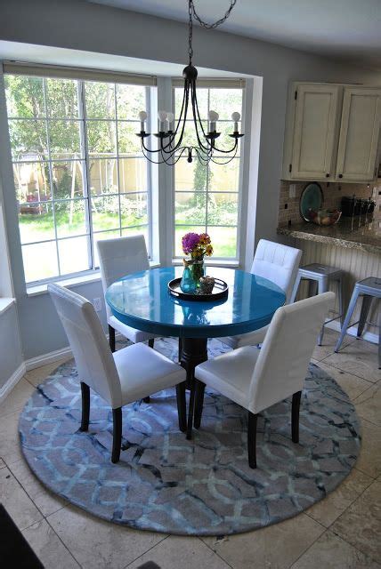 For a round rug under a round table, place the table in the center. The Friday Five: Safavieh Dip Dye Rugs | Round kitchen ...