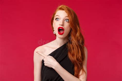 close up portrait of speechless impressed redhead woman drop jaw in amazement seeing something