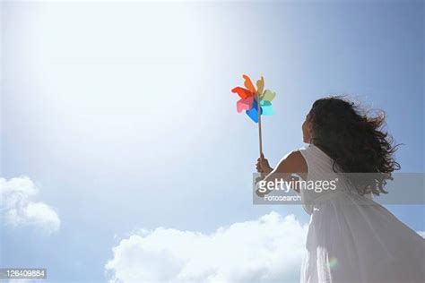 Woman Holding Pinwheel Photos And Premium High Res Pictures Getty Images